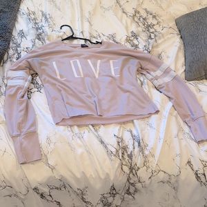 A pink love sweater with white strips